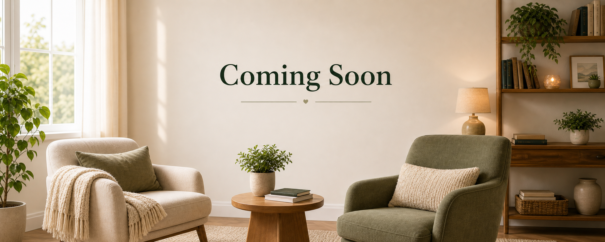 Coming Soon — a calm counseling room with two chairs, warm light, plants, and a botanical divider.